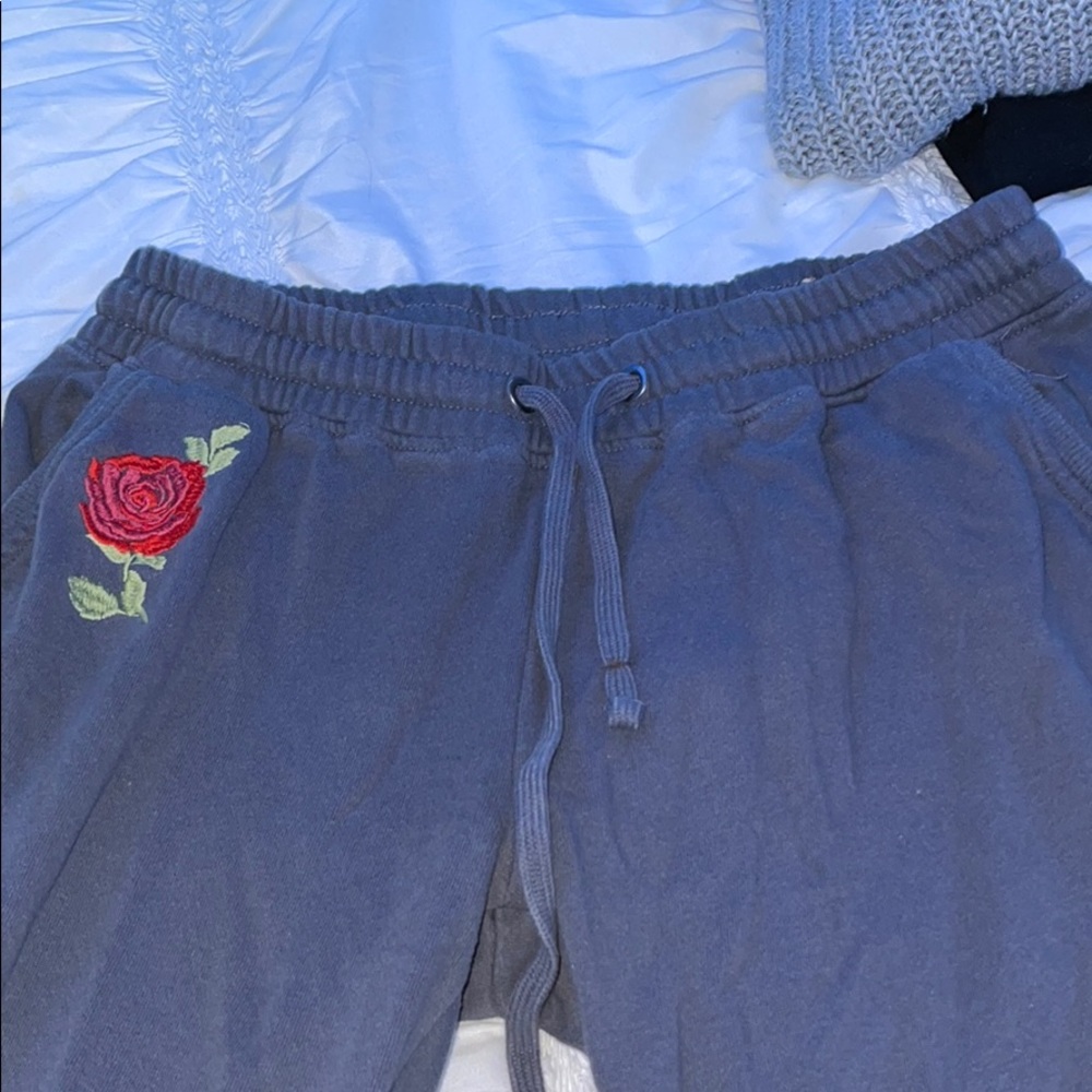 Dark grey joggers with red roses
